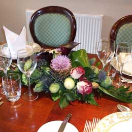 Artichoke, rose and viburnum table decoration