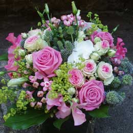 Pink rose and spray rose handtie with sweet peas, eryngium, lisianthus and bouvardia