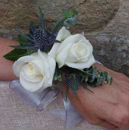 White rose and eryngium wrist corsage