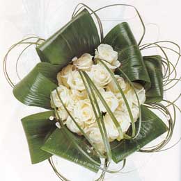 Cream roses and bear grass in handtie