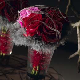 Roses adorned with feathers